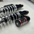 Close-up view of adjustable compression clicker on RWD RS-2 Rear Shock Absorber for 1984 - 2000 Harley Davidson FXR (CHROME SPRING)
